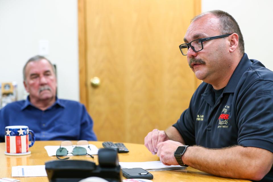 Wayne Township fire chief Mike Lang (right) and trustee Chuck Jones speak with IndyStar on Tuesday, Aug. 10, 2021. Lang explains a slew of expenditures that have raised some questions from the public and the township's board. 