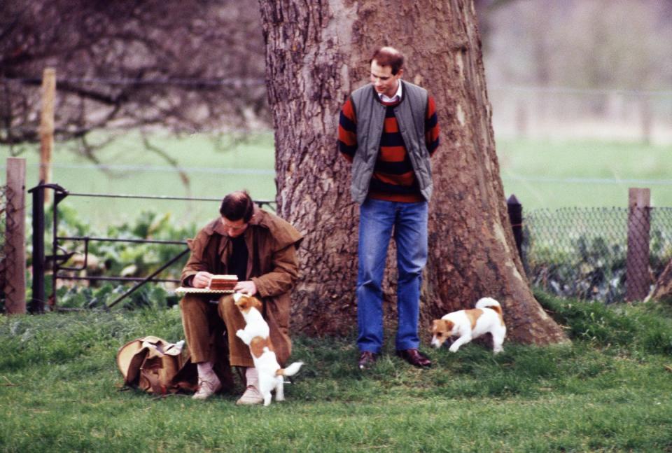 <p>Prince Charles sketching on the bank of the River Thames with Prince Edward and two canine companions.</p>