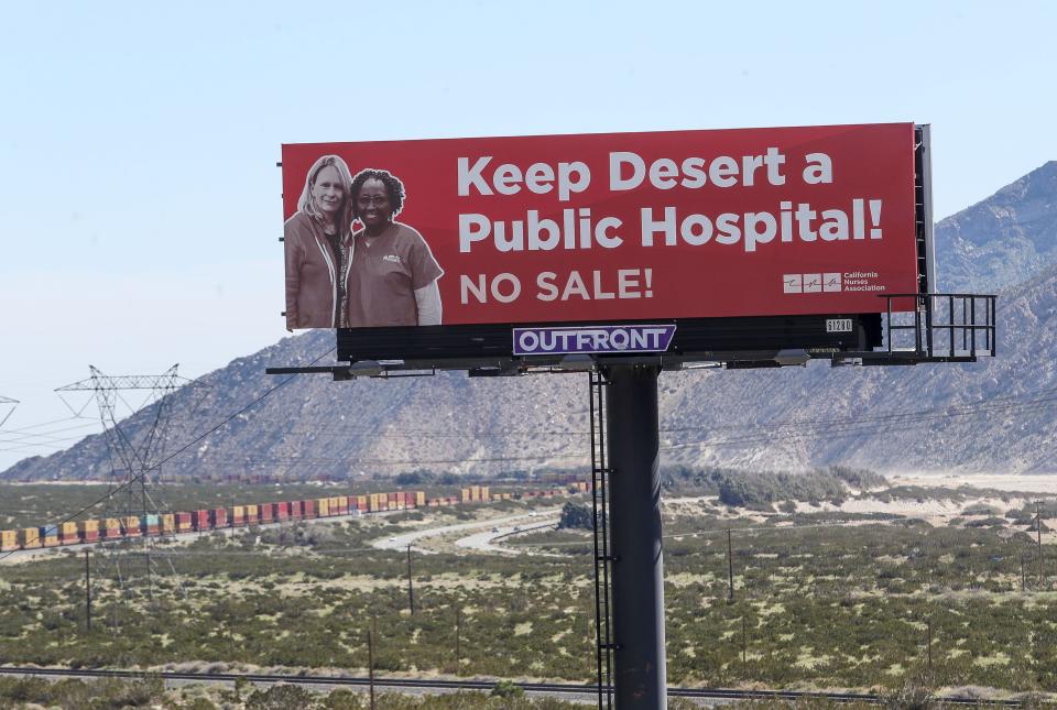 A billboard paid for by the California Nurses Association reads "Keep Desert a Public Hospital! No Sale" just east of where Highway 111 meets Interstate 10 near Palm Springs.