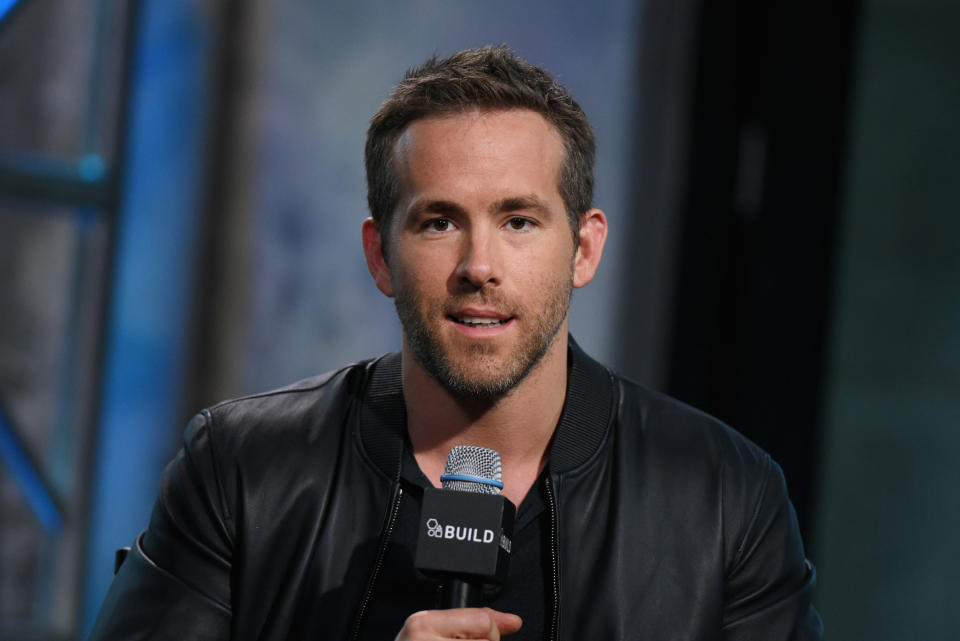 Ryan Reynolds talking into a microphone