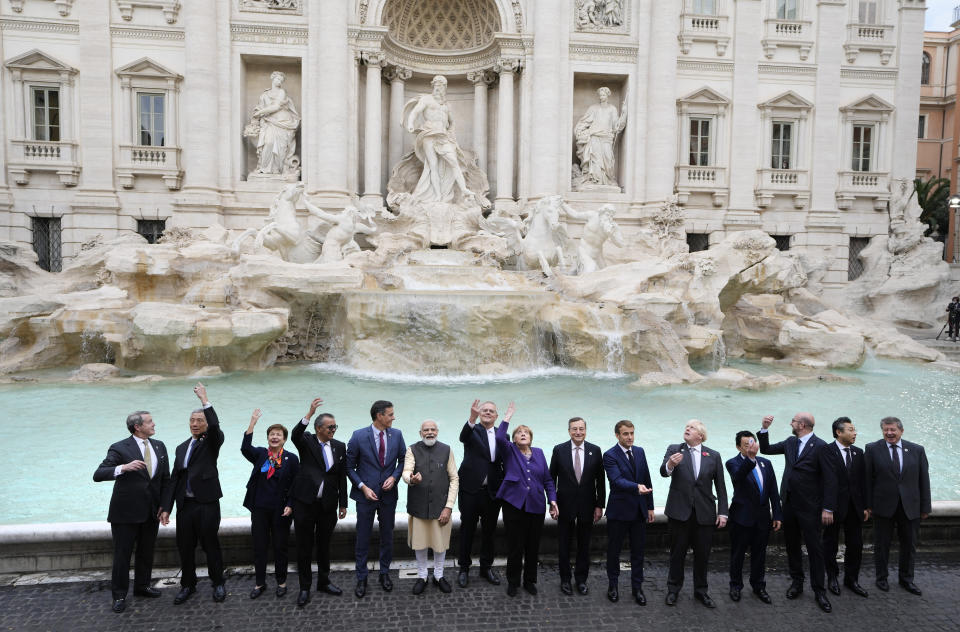 FILE - Leaders of the G20 pose in front of the during Trevi Fountain during an event for the G20 summit in Rome, Sunday, Oct. 31, 2021. Chinese President Xi Jinping has been absent from the Group of 20 summit in Rome and global climate talks in Scotland, drawing criticism from U.S. President Joe Biden and questions about China's commitment to reducing greenhouse gas emissions. (AP Photo/Gregorio Borgia, File)