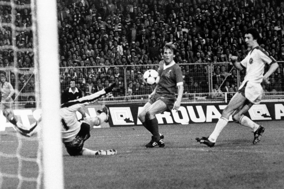 FILE - In this May 11, 1978 file photo, Kenny Dalglish of Liverpool, dark shirt, centre, scores the only goal of the match against Bruges during the European Cup Final at Wembley Stadium, London. K is for King Kenny. Dalglish's years at Liverpool were among the club's most successful periods and were very much part of England's dominance of the competition in the late 1970's and early 80's as first Liverpool, then Nottingham Forest, Aston Villa and then Liverpool again won the European Cup 7 times in 8 years. (AP Photo, File)