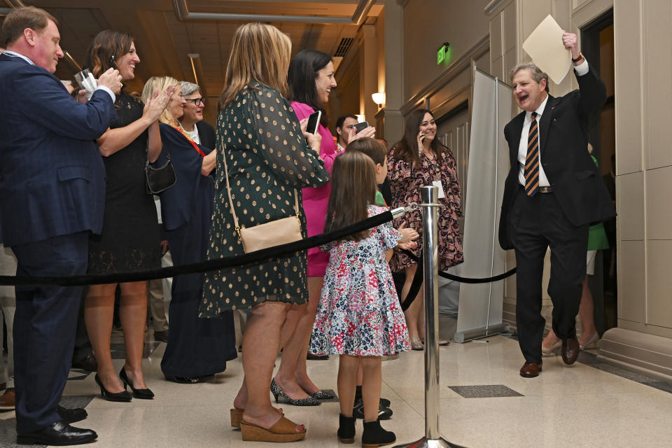 Sen. John Kennedy, right, walks in the ballroom to address supporters during his election night party, Tuesday, Nov. 8, 2022, at the Lod Cook Alumni Center on the campus of LSU in Baton Rouge, La. (Hilary Scheinuk/The Advocate via AP)