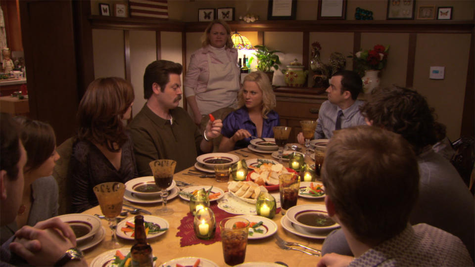 Leslie Knope (Amy Poehler) at a dinner with friends in Parks and Recreation