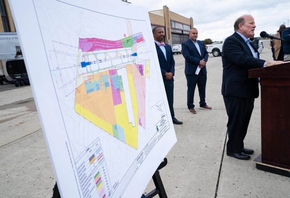 Mayor Mike Duggan helps to make an announcement concerning the layout approval for the Coleman A. Young Municipal Airport on Oct. 13, 2022.