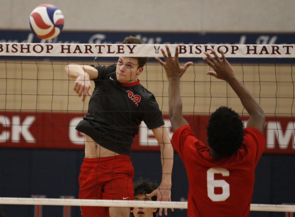 St. Charles' Noah Franz spikes the ball against Hartley last season.