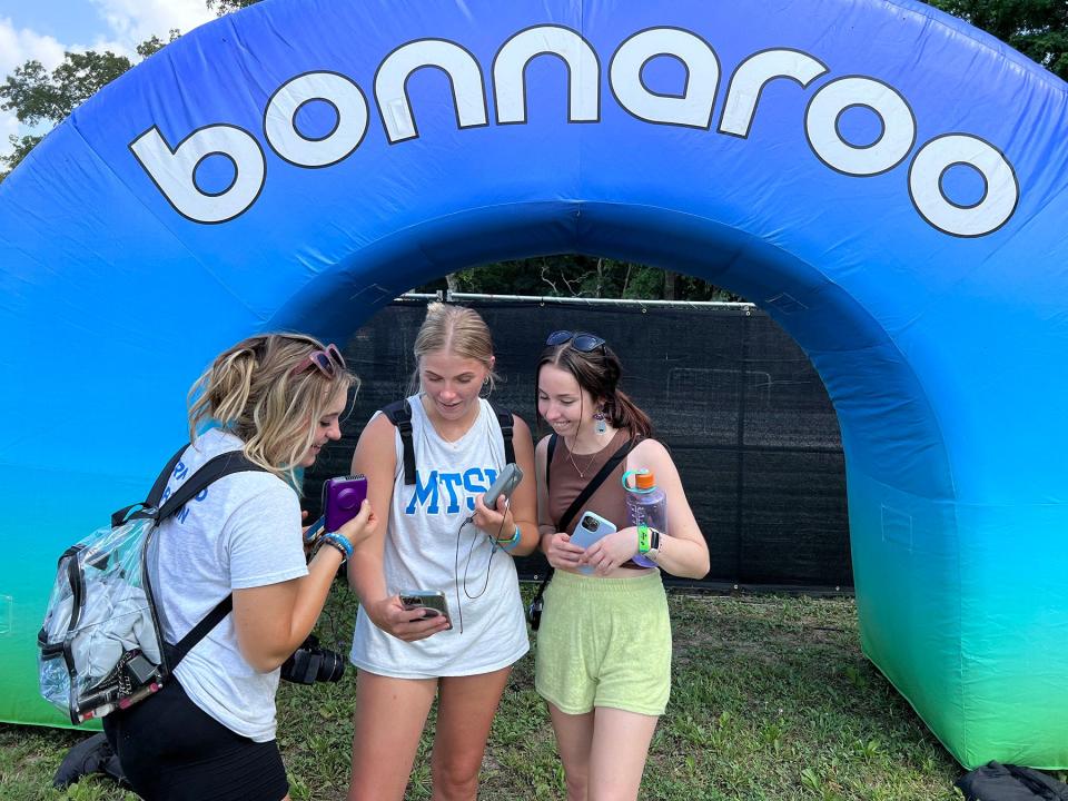 From left, MTSU students Izzy Gutierrez, a sophomore journalism major from Nashville, Tenn.; Rebekah McGuire, a marketing and elementary education junior from Murfreesboro; and MTSU video producer Rachel Byrnes, review video for social media Wednesday, June 15, as part of coverage of the 2022 Bonnaroo Music and Arts Festival June 16-19 in Manchester, Tenn.