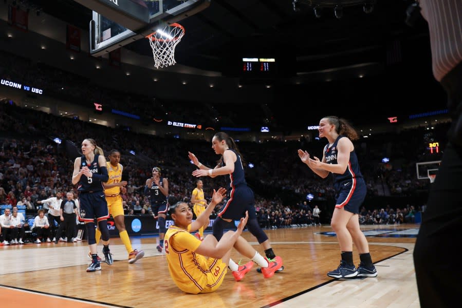 Southern California guard JuJu Watkins (12) reacts after having a shot blocked during the second half of an Elite Eight college basketball game against UConn in the women’s NCAA Tournament, Monday, April 1, 2024, in Portland, Ore. (AP Photo/Howard Lao)