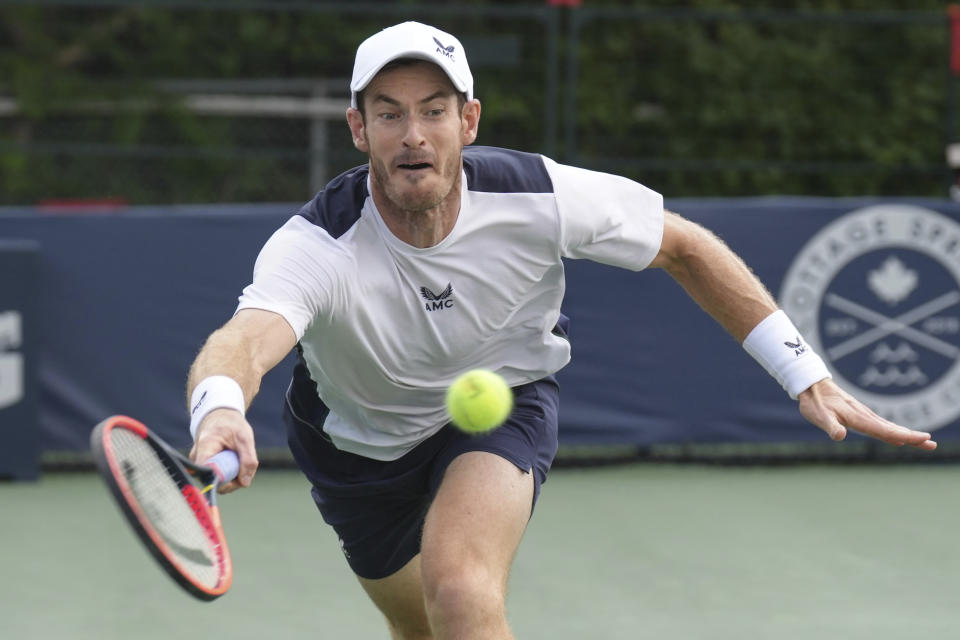 Britain's Andy Murray strains to reach a shot from Australia's Max Purcell during the National Bank Open men’s tennis tournament Wednesday, Aug. 9, 2023, in Toronto. (Chris Young/The Canadian Press via AP)