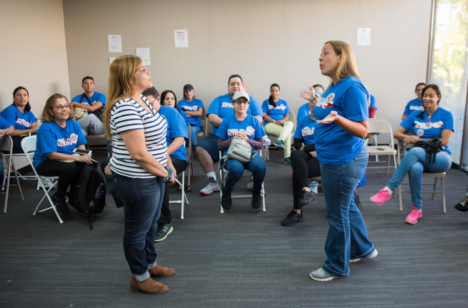 Canvassers working with Vamos4PR participate in a training exercise on how to approach people at their homes. (Photo: Chris McGonigal/HuffPost)