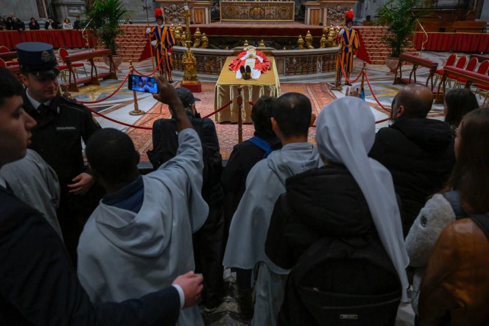 The body of the late emeritus Pope Benedict XVI lies inside St. Peter’s Basilica, where thousands of people came to say goodbye to the former pontiff (AP/Vatican News Service)