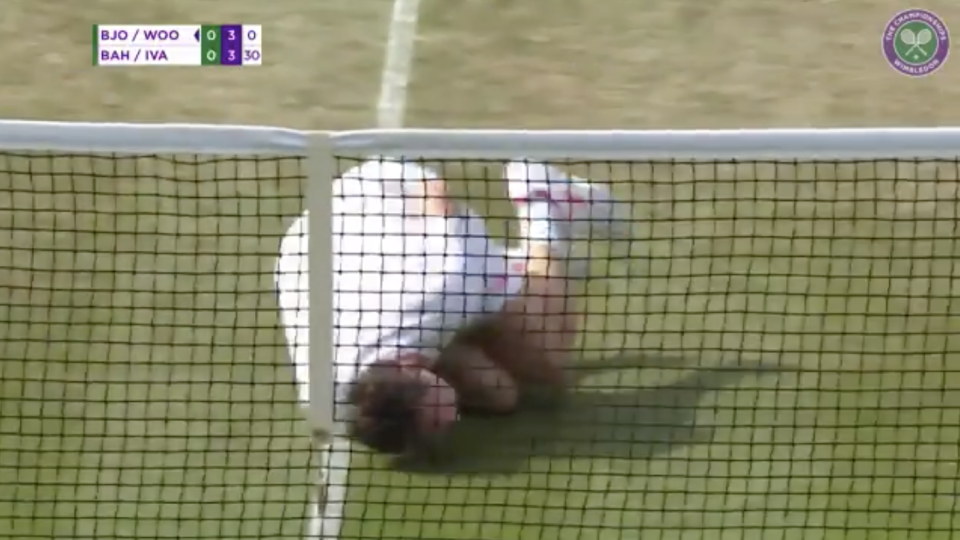 After being hit by the ball by his own partner, Jonas Bjorkman flopped to the ground and rolled around in “pain,” giving fans at Wimbledon on Thursday his best Neymar impression. (Twitter/Wimbledon)