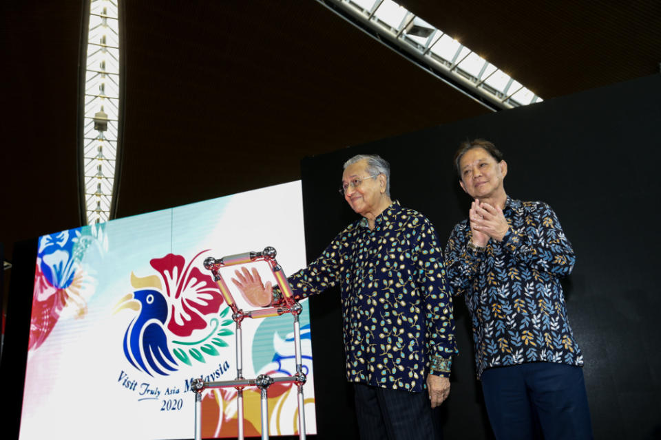 Tun Dr Mahathir Mohamad together with Tourism Minister Datuk Mohammadin Ketapi during the unveiling of the new Visit Malaysia 2020 logo at KLIA, Sepang July 22,2019. — Picture by Ahmad Zamzahuri