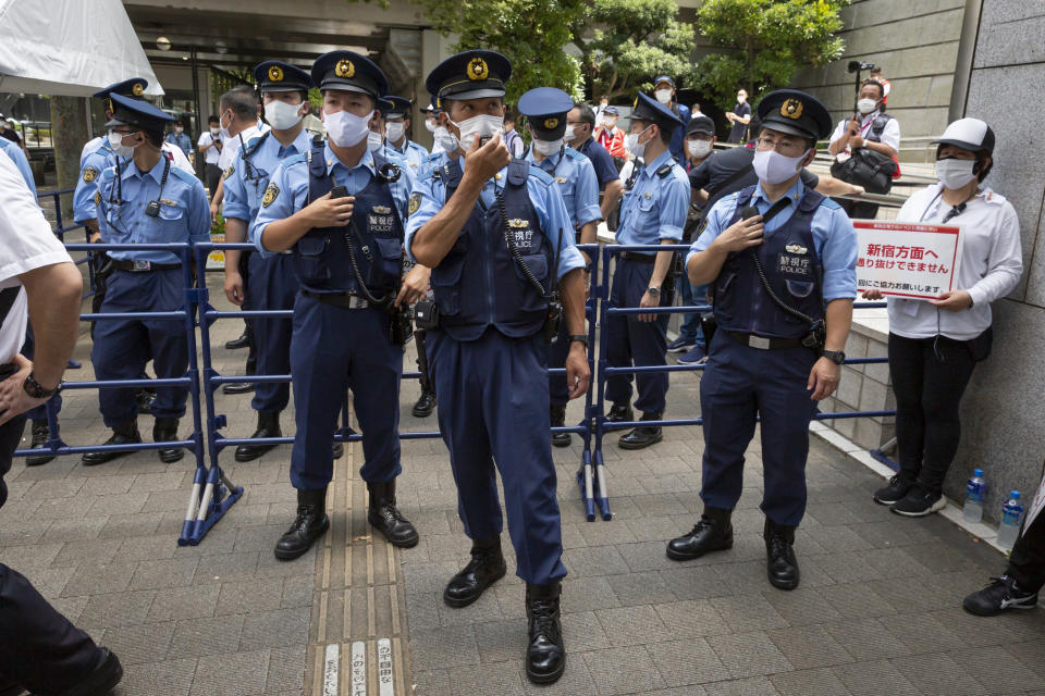 <p>Police officers stand in front of a gate of the Olympic Torch Relay Celebration event venue during a protest against Tokyo 2020 Olympics on July 23, 2021 in Tokyo, Japan. Protesters gathered to demonstrate against the Olympic Games amid concern over the safety of holding the event during the global coronavirus pandemic as well as the cost incurred. (Photo by Yuichi Yamazaki/Getty Images)</p> 