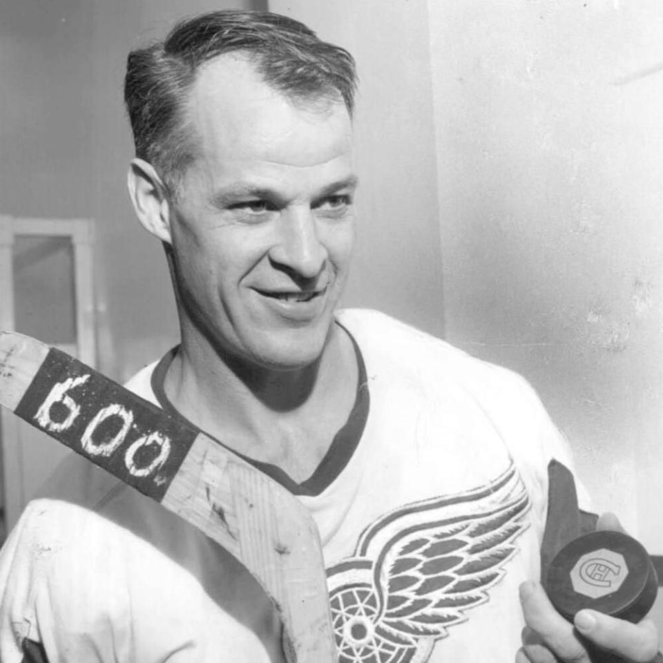  Gordie Howe poses with the hockey stick and puck from his 600th career goal in 1965.