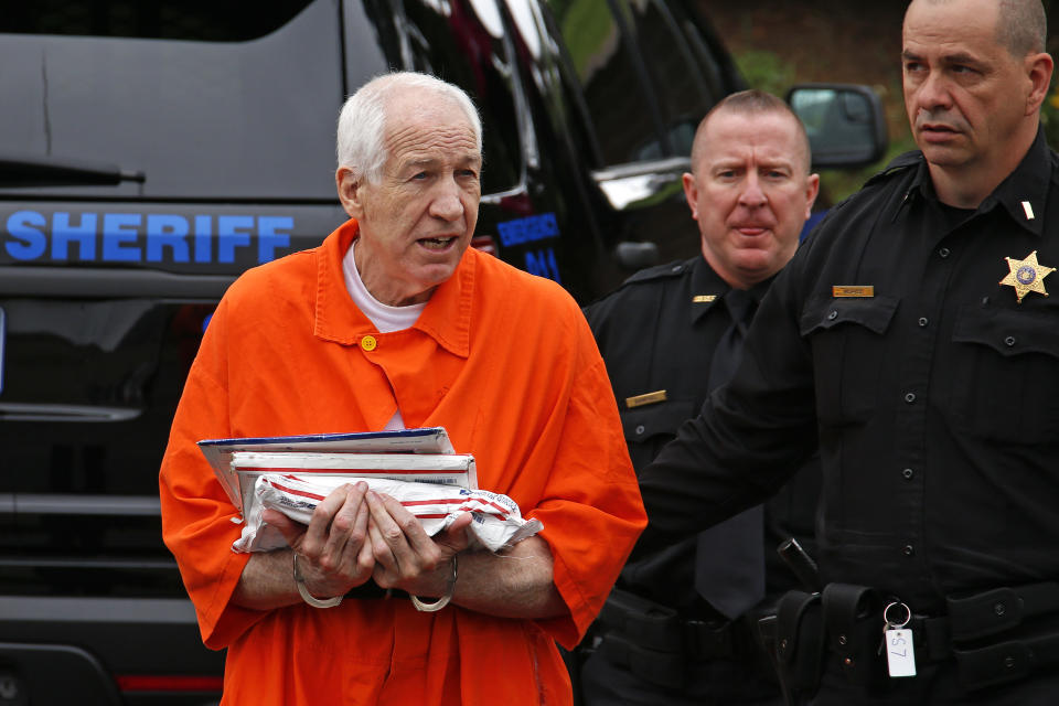 Former Penn State University assistant football coach Jerry Sandusky, left, arrives at the Centre County Courthouse for arguments on his request for an evidentiary hearing as he seeks a new trial in Bellefonte, Pa. Monday, May 2, 2016. (AP Photo/Gene J. Puskar)