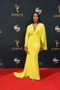 Angela Bassett earned praise for her Christian Siriano yellow kimono dress with a plunging neckline