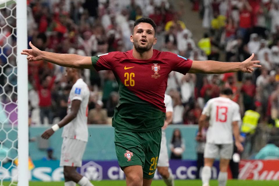 Portugal's Goncalo Ramos celebrates after scoring his side's fifth goal during the World Cup round of 16 soccer match between Portugal and Switzerland, at the Lusail Stadium in Lusail, Qatar, Tuesday, Dec. 6, 2022. (AP Photo/Alessandra Tarantino)