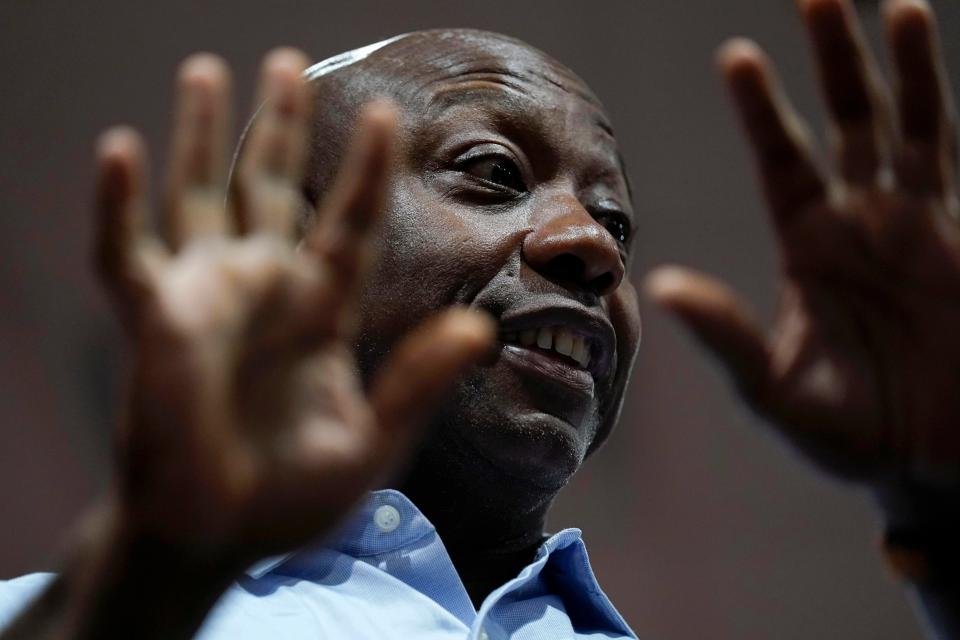 Republican presidential candidate Sen. Tim Scott, R-S.C., speaks during a meet and greet, Thursday, Oct. 12, 2023, in Newton, Iowa.