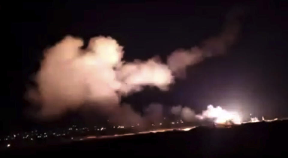 This frame grab from a video provided by the Syrian official news agency SANA shows missiles flying into the sky near Damascus, Syria, Tuesday, Dec. 25, 2018. Israeli warplanes flying over Lebanon fired missiles toward areas near the Syrian capital of Damascus late Tuesday, hitting an arms depot and wounding three soldiers, Syrian state media reported, saying that most of the missiles were shot down by air defense units. (SANA via AP)