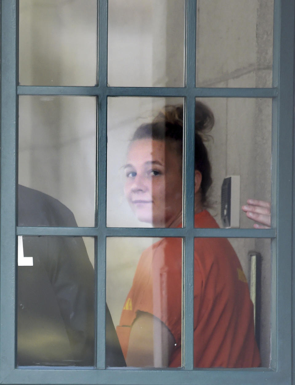 Reality Winner, who pleaded guilty to mailing a classified U.S. report to a news organization, walks out of a courthouse in Augusta, Ga., Thursday, Aug. 23, 2018, after being sentenced to more than five years in prison. (Michael Holahan/The Augusta Chronicle via AP)