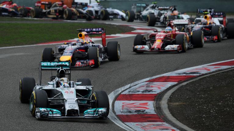 Mercedes AMG Petronas driver Lewis Hamilton (front) takes a turn during the Formula One Chinese Grand Prix, in Shanghai, on April 20, 2014