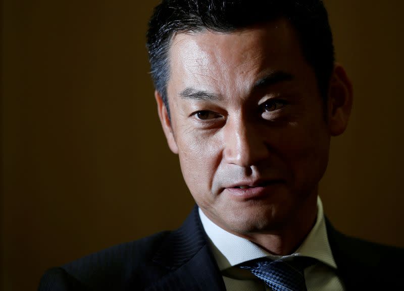 FILE PHOTO: Japan Post Bank Chief Investment Officer Katsunori Sago speaks during an interview for the Reuters Global Investment Outlook Summit in Tokyo