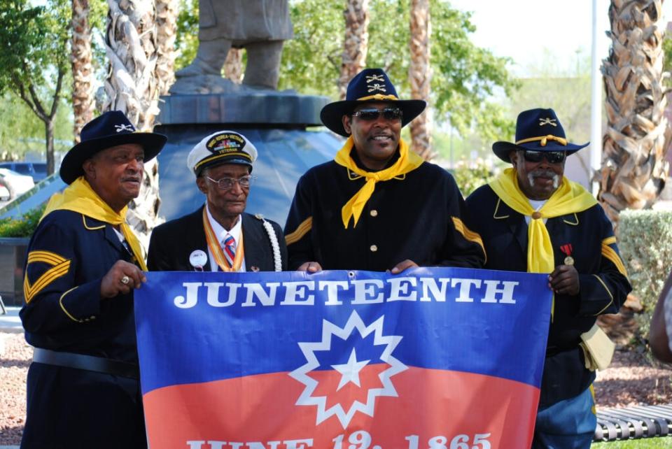 People holding Juneteenth flag (Source: Juneteenth Unityfest website)