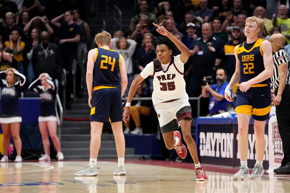 Harvest Prep's Ephraim Campbell (35) reacts after Ottawa-Glandorf's Colin White (22) misses a shot at the buzzer, giving the Warriors a 61-59 win in a Division III state semifinal Friday at University of Dayton Arena.