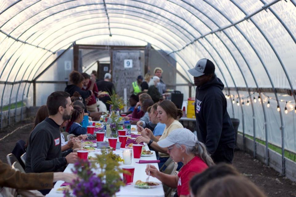 Kinship Community Food Center hosts a monthly "Feast" meal at its urban farm on Port Washington Road in Milwaukee when the weather allows. Food center director Caitlin Cullen, the former chef-owner of the Tandem restaurant in Milwaukee, cooks most of the food for the meal.