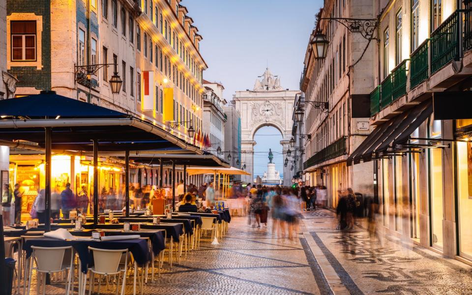 street with outdoor tables in Lisbon - Matteo Colombo /Digital Vision 
