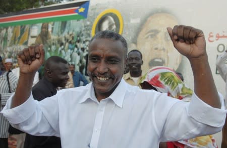 FILE PHOTO: Yasir Arman, a senior member of the SPLM, dances during a party celebrating Barack Obama's election as US president in Khartoum