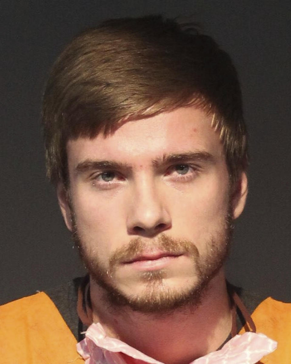 This Sept. 23, 2020 booking photo provided by the Washoe, Nev., County Sheriff's Office shows Egor Igorevich Kriuchkov, who pleaded guilty in federal court on Thursday, March 18, 2021, to a conspiracy charge, admitting he offered a Tesla employee $1 million to cripple the electric car company's plant in Nevada with ransomware in an extortion scheme. (Washoe County Sheriff's Office via AP).