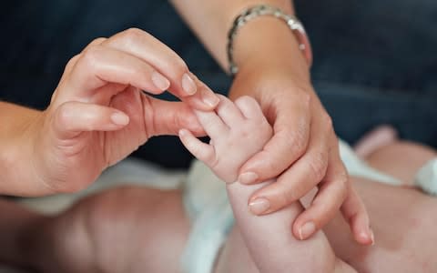 baby hand check  - Credit: Alamy 