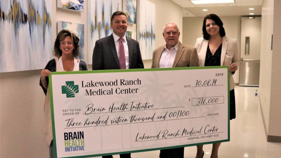 A $316,000 gift from Lakewood Ranch Medical Center helps the Brain Health Initiative stay on course for launching a pilot program in the spring. Shown aboveon 10/9/2019 are, left, Stephanie Peabody, executive director, Andy Guz, hospital CEO, Rex Jensen, CEO of Schroeder-Manatee Ranch, and Monaca Onstad, director of community relations for LWR Communities.