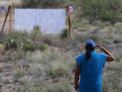 <p>A military veteran pays his respects, as John McCain has discontinued medical treatment for an aggressive form of brain cancer, at the entrance to the McCain ranch complex in Cornville, Ariz., Saturday, Aug. 25, 2018. (Photo: Ross D. Franklin/AP) </p>