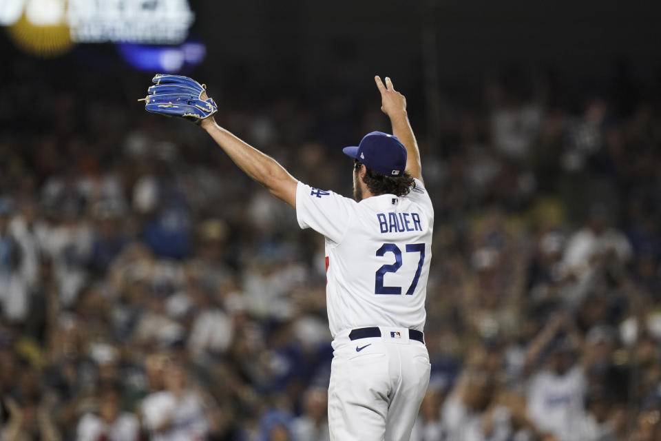 Los Angeles Dodgers' Trevor Bauer celebrates after striking out San Francisco Giants' Darin Ruf to end the sixth inning of a baseball game, Monday, June 28, 2021, in Los Angeles. (AP Photo/Jae C. Hong)