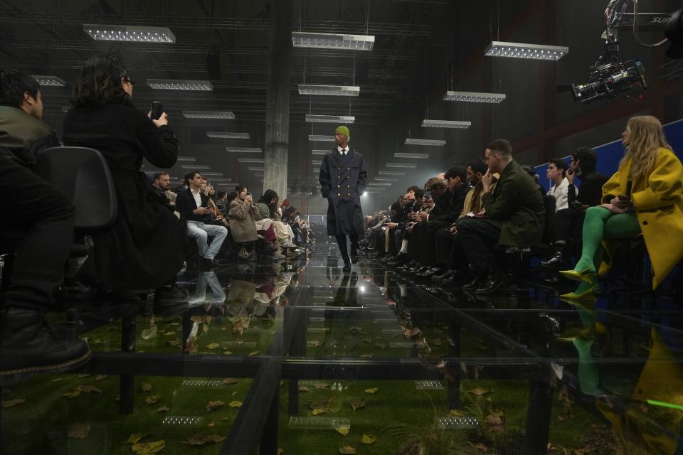 A model wears a creation part of the men's Prada Fall-Winter 2024-2025 collection, that was presented in Milan, Italy, Sunday, Jan. 14, 2024. (AP Photo/Luca Bruno).