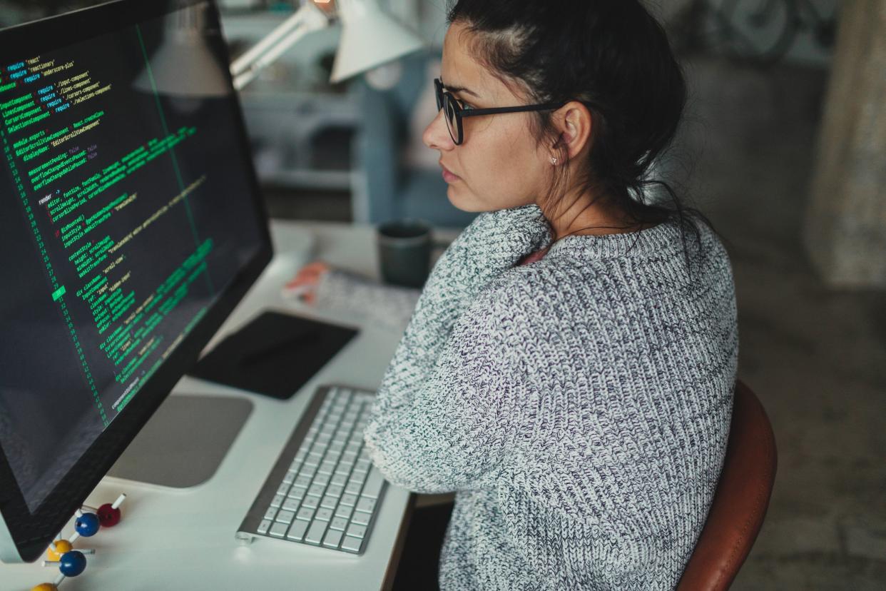 young woman programming at her home office