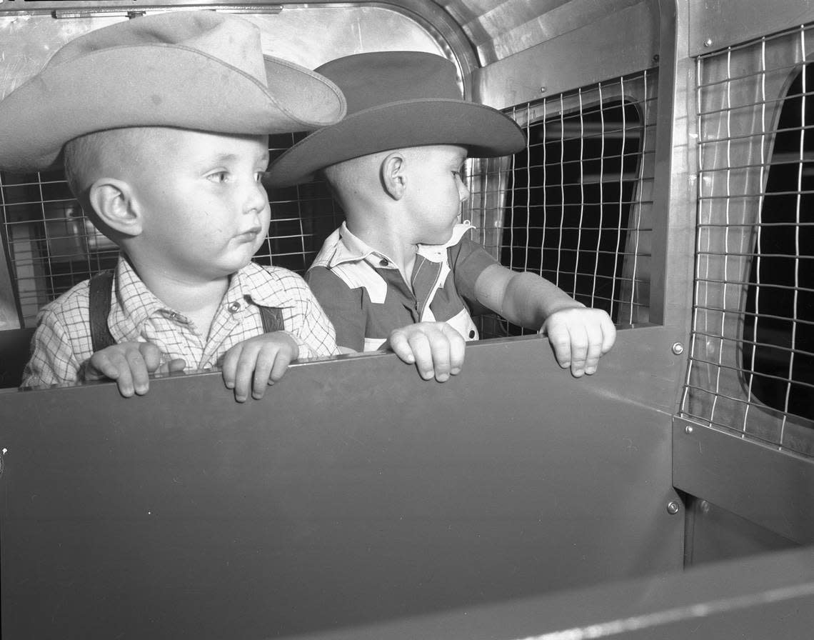 Dec. 20, 1949: Kenny and Stanley Bennett of Arlington ride Leonard Brothers department store’s Santa’s Rocket Express in Toyland