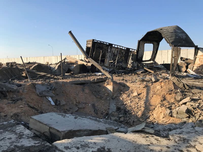 Debris and rubble are seen at the site where an Iranian missile hit at Ain al-Asad air base in Anbar province