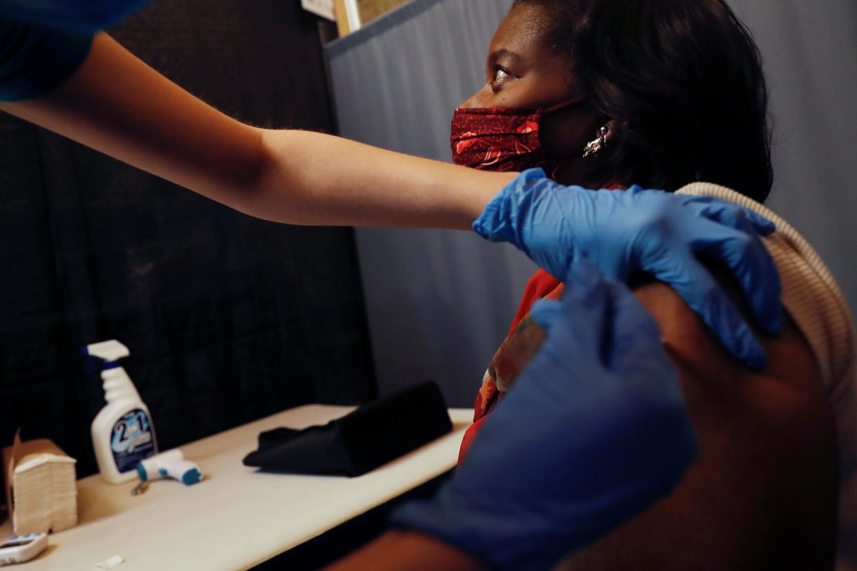 Metropolitan Transportation Authority (MTA) worker Sasha Boyd receives the Pfizer COVID-19 vaccination for MTA employees at Vanderbilt Hall at Grand Central Terminal  in the Manhattan borough of New York, U.S. March 10, 2021. REUTERS/Shannon Stapleton