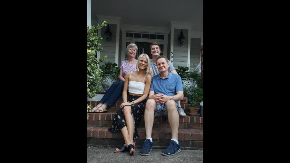 Erin Simanskis, left, pictured with her husband Ed and her two children, Emily and Eric, outside of their home in Cary.