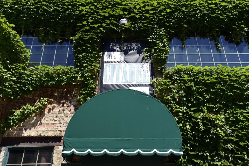 The entrance to the Citadel building on Huron Ave., in downtown Port Huron on Friday, August 12, 2022. The building which includes the theatre space occupied by Enter Stage Right, a Primerica office space, Red Kettle Coffee Roasters, and upstairs lofts, is up for sale by the owners.