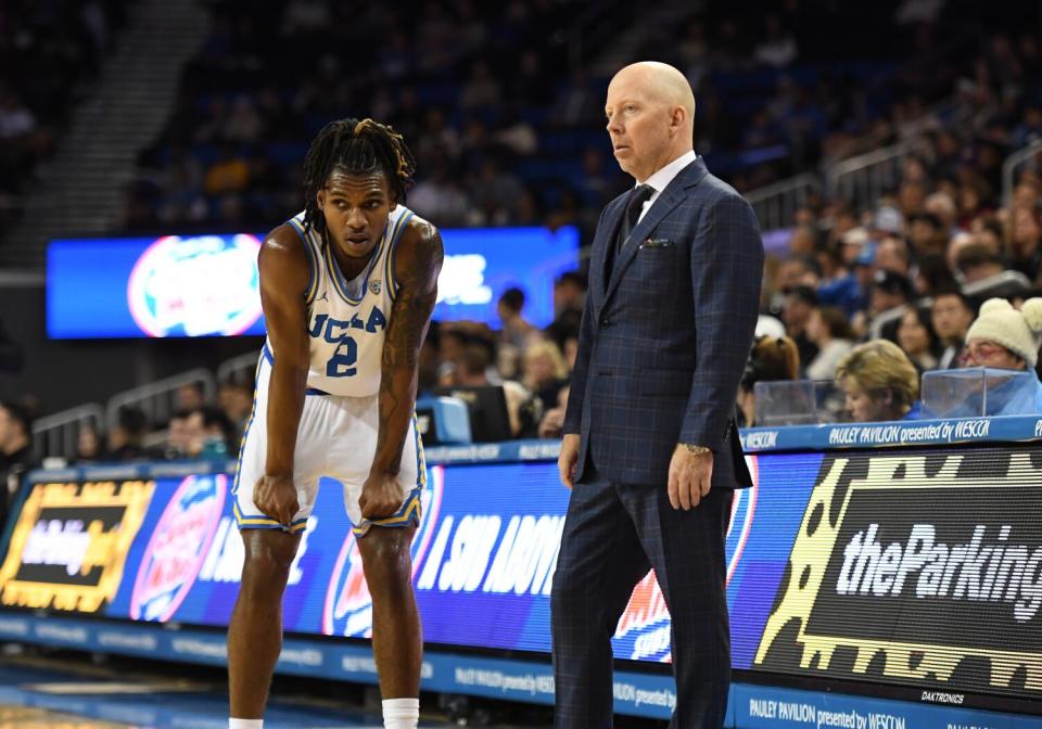 UCLA guard Dylan Andrews listens to coach Mick Cronin.