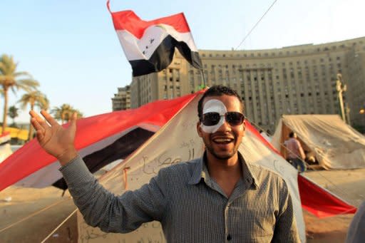 Egyptian Mustafa Sorror, who lost his eye on January 28 during the revolution that ousted President Hosni Mubarak, stands outside his tent pitched in Tahrir Square as he and others to push for further reforms in Cairo. Mubarak's murder trial on August 3 will take place in Cairo, the state news agency MENA said Thursday, a move likely to appease activists but create a logistical nightmare