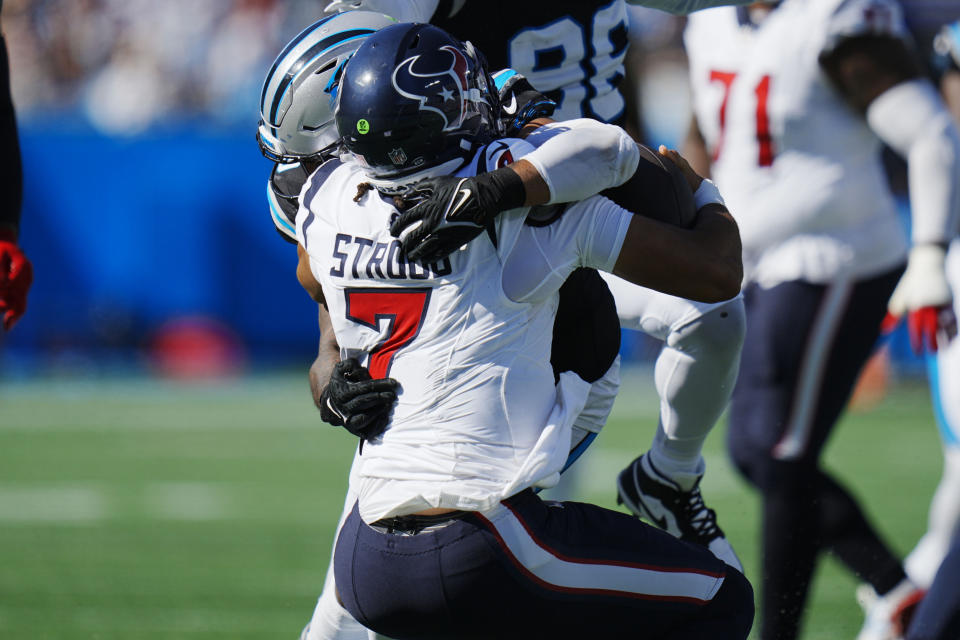 Houston Texans quarterback C.J. Stroud (7) is sacked by Carolina Panthers linebacker Frankie Luvu (49) during the first half of an NFL football game, Sunday, Oct. 29, 2023, in Charlotte, N.C. (AP Photo/Rusty Jones)