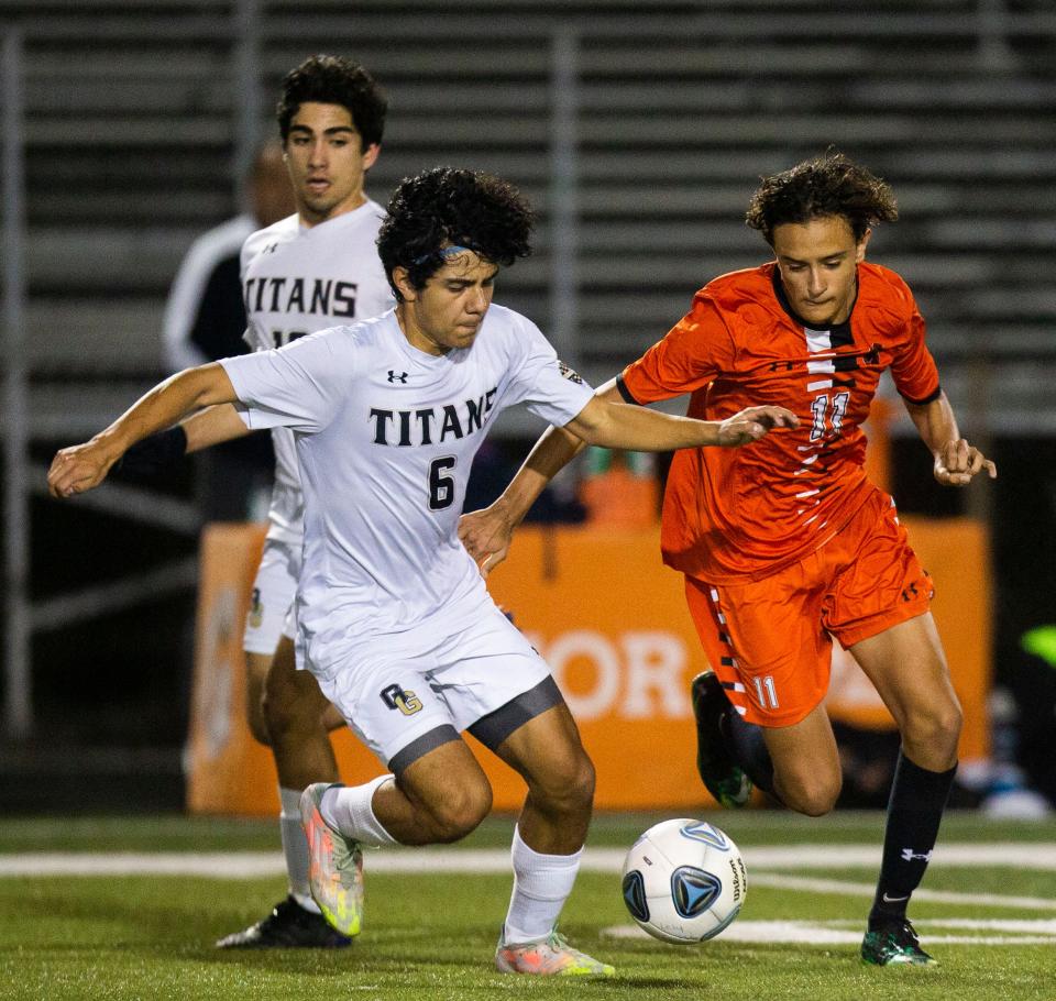 Golden Gate's Christian Rico (6) and Lely's Alesandro Sarasini (11) battle for the ball during the boys soccer game between Golden Gate and Lely on Tuesday, Feb. 1, 2022 at Lely High School in Naples, Fla. 