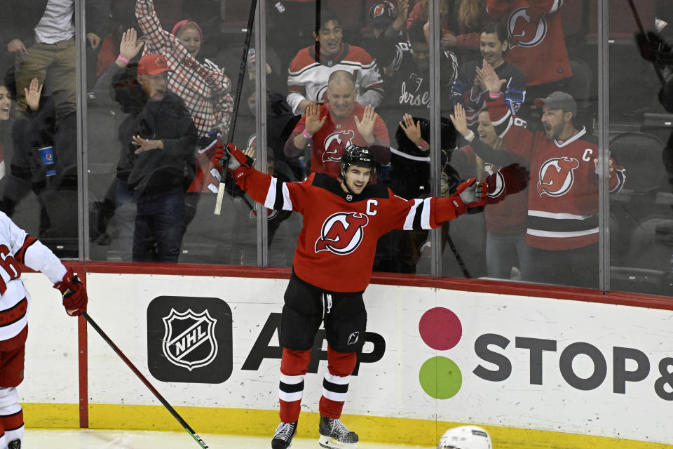 FILE - New Jersey Devils center Nico Hischier (13) celebrates his goal during the third period of an NHL hockey game against the Carolina Hurricanes, Saturday, April 23, 2022, in Newark, N.J. Coming into the 2022-2023 season, the Devils have missed the playoffs the last four years. (AP Photo/Bill Kostroun, File)