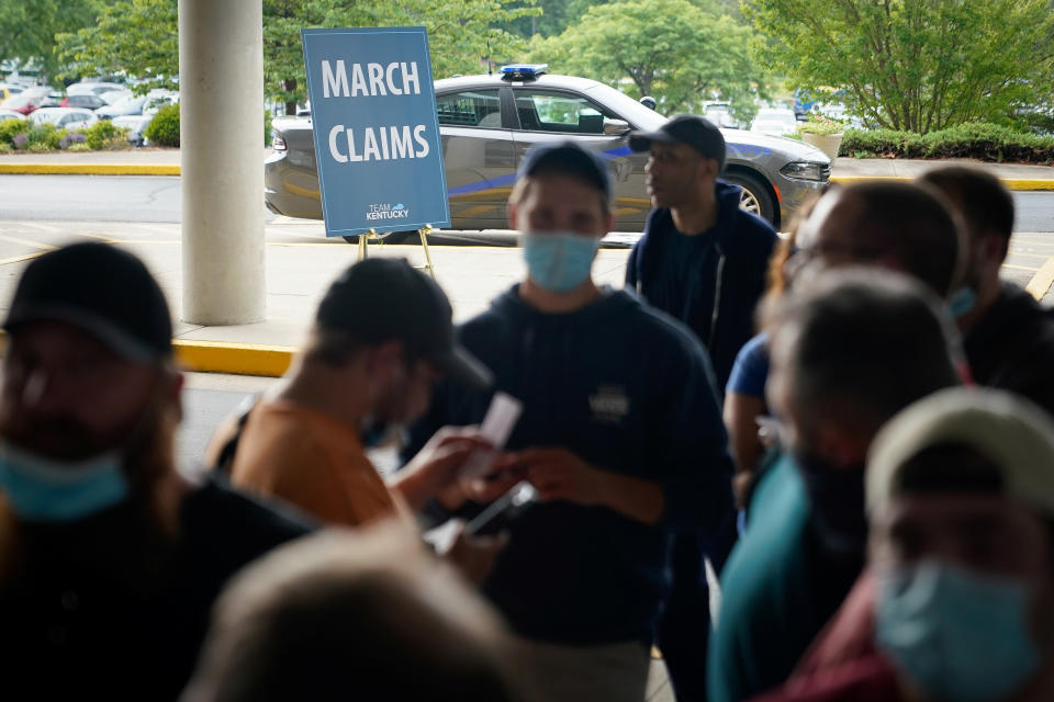 People line up outside a Kentucky Career Center hoping to find assistance with their unemployment claim in Frankfort, Kentucky, U.S. June 18, 2020. REUTERS/Bryan Woolston